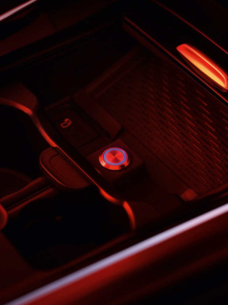 La vue latérale d'une Classe T transformée pour les personnes à mobilité réduite et un joueur de basket-ball en fauteuil roulant.