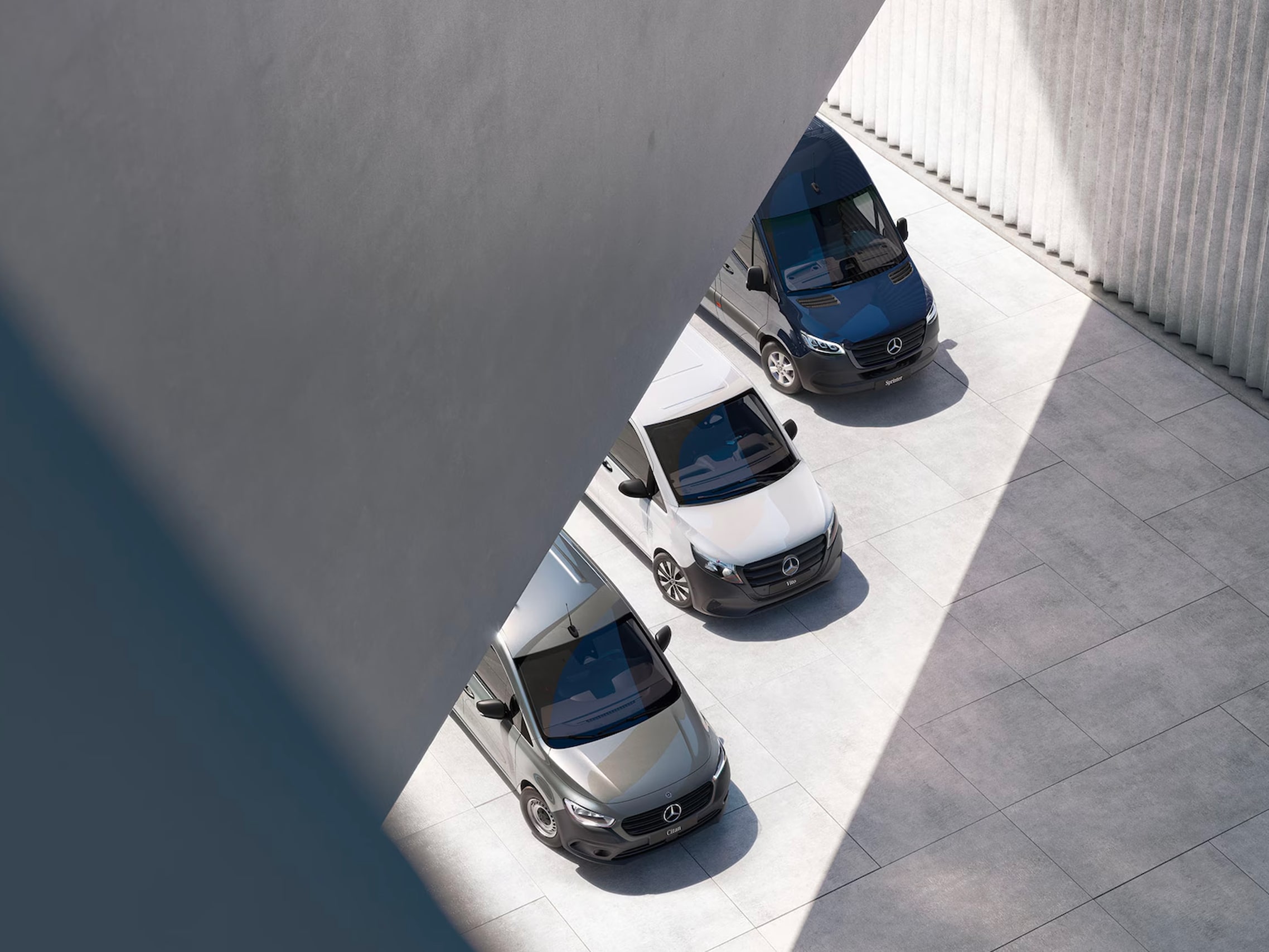 Image représentant trois véhicules utilitaires Mercedes-Benz