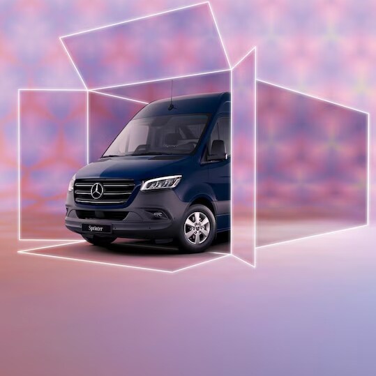 The Mercedes-Benz Vito Tourer is parked in front of a glass building.