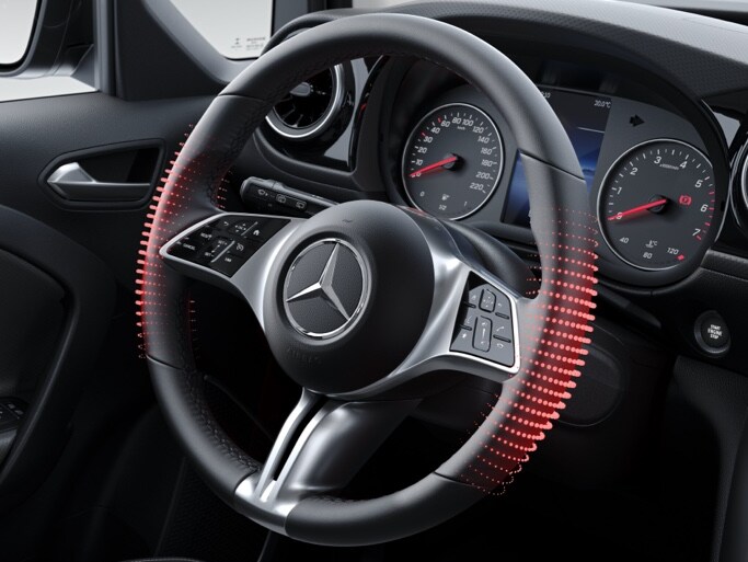 Le volant multifonctions chauffant dans le poste de conduite de la Classe T de Mercedes-Benz.