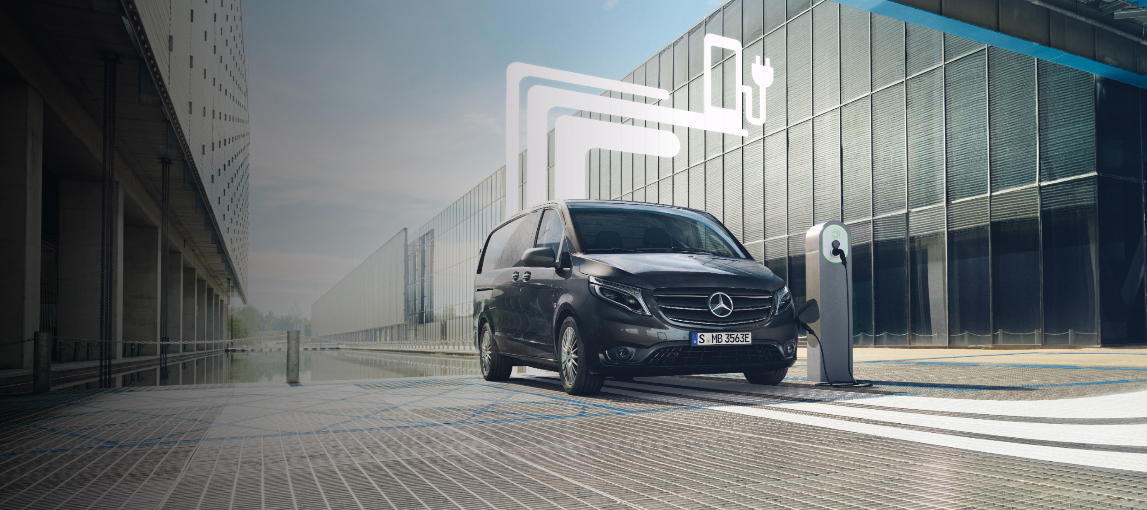Electromobilité | Offres digitales | Mercedes-Benz Un utilitaire léger Mercedes-Benz avec des éléments graphiques représentant les offres digitales.