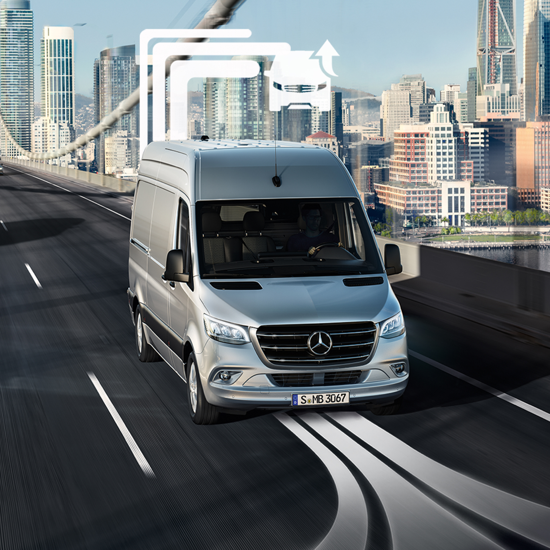 Mercedes-Benz Store | Offres digitales | Mercedes-Benz Un Mercedes-Benz Sprinter sur la route avec un élément graphique.